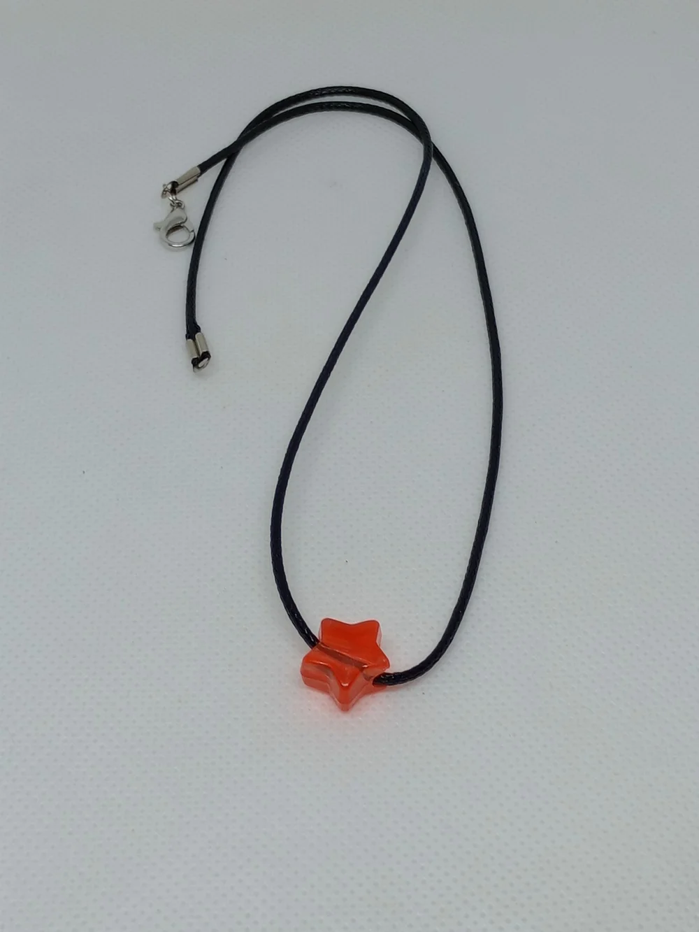 Orange Star Pendant Necklace on Black Cord